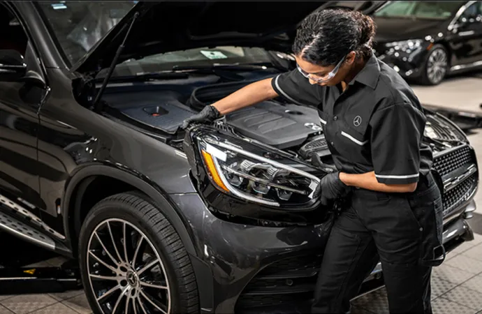 Technician replacing Mercedes GLE headlight Farmington