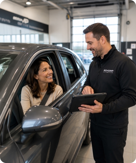 Schomp service advisor assisting a teacher with her vehicle